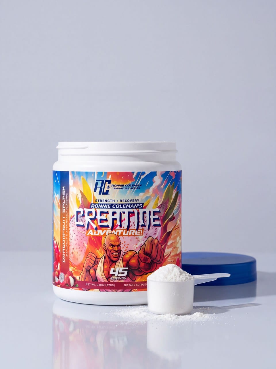 The DragonFruit Splash tub beside a full scoop of white powder and its blue lid